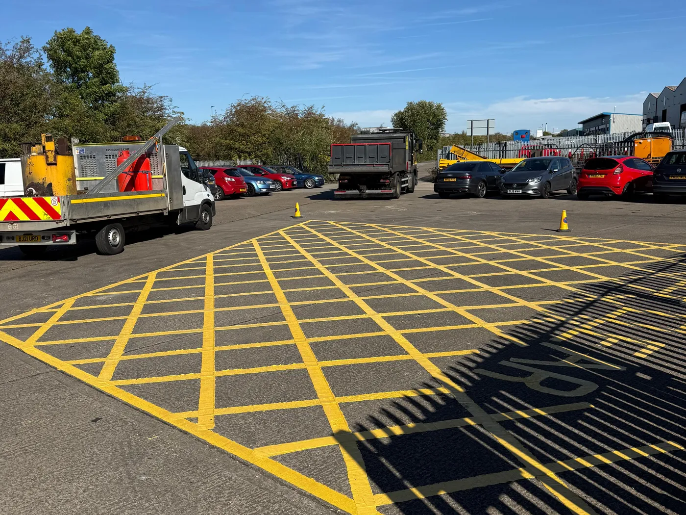 Yellow box hatching at a depot entrance
